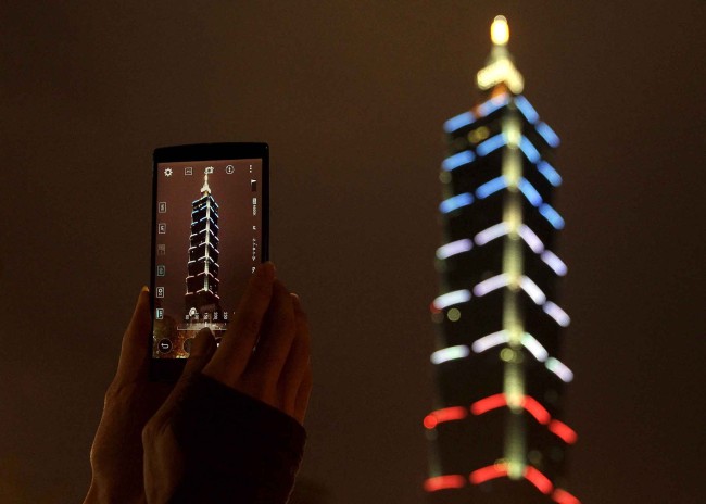 Taiwan's landmark building Taipei 101 is lit up in blue, white and red, the colors of the French flag, following the Paris attacks, in Taipei